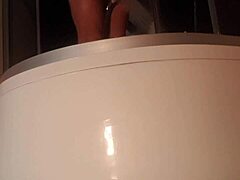 Solo guy stroking cock in steamy shower scene