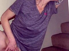 Redhead wife strips in solo scene