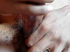 Stroking mighty ebony shaft gently