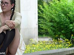 A submissive girl with natural big tits shows her body in public