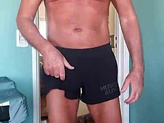 Muscular hunk in tight shorts