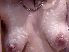beautiful assol bathes with soapy foam covering her sexy naked body