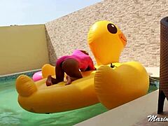 Maxine X uses a BBC toy for poolside pussy play.