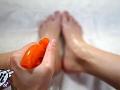 brunette shows oiled feet and legs closeup 😍