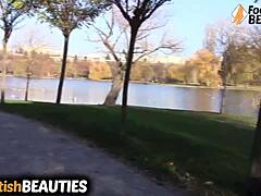 Look at this brunette babe slipping off socks to go barefoot in the park!