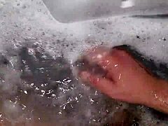 Watch me jerk off in the hot tub with relaxing music and foam all over my cock!