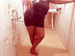 Descriptive view of a sexy Myanmar milf taking a relaxing shower, bathing her body