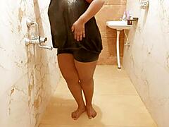 Descriptive view of a sexy Myanmar milf taking a relaxing shower, bathing her body