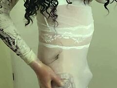 Sara crossdresser wears white nylon and pisses on beach