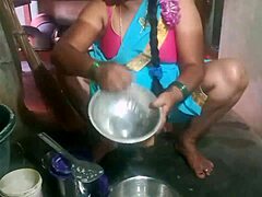 Indian sexy aunty cleans plates while teasing in the dorm