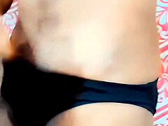 feminine sissy masturbates her limp clitty in oiled miniskirt.