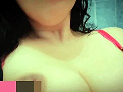 she's very horny and goes into the bathroom to masturbate, squirting for the first time