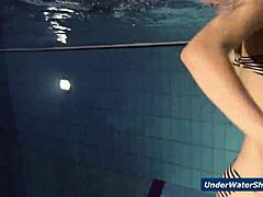 these horny czech girls start stripping each other down in the pool, getting all nude and playful underwater in their bikinis