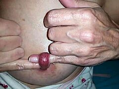 Nippleringlover as a kinky milf fingers her extreme stretched nipple piercings with two fingers through