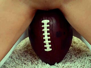 Provocative teen cinthia doll humps football in daring solo tease