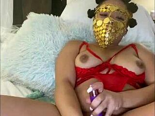 Masked ebony talks dirty while making pussy cum