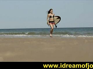 surfs up with a solo beach tease by brunette