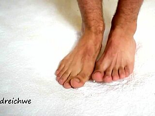 man’s huge feet dominate the scene