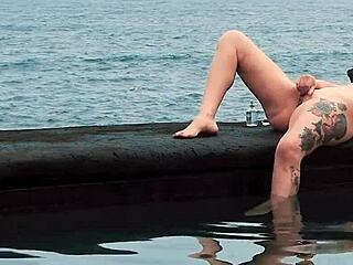 Free spirited girl with a tattoo gets a wet pussy solo pleasure by the sea