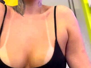 Tanned amateurs show off big natural tits in public gym