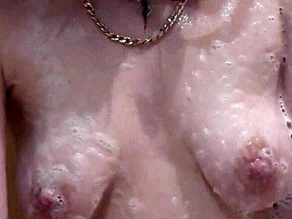 beautiful assol bathes with soapy foam covering her sexy naked body