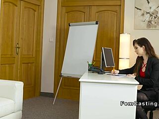female agent offers face sitting to model on sofa