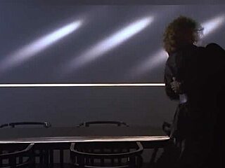 Kim Basinger’s Blonde Tease On Retro Desk
