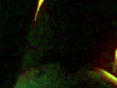 sexy tattooed curvy woman with piercings moaning softly in a relaxed setting