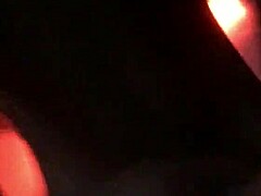 sexy tattooed curvy woman with piercings moaning softly in a relaxed setting