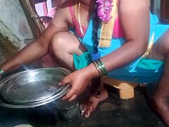 Indian sexy aunty cleans plates while teasing in the dorm