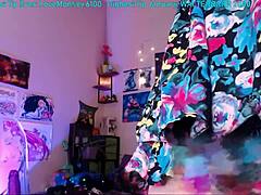 Trickynymph teases with a dildo on clear chair.