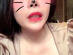 Asian girl shows off big tits in sexy live session