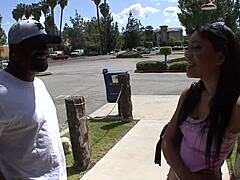 She's taking on that massive cock, bending over in doggystyle while he pounds her pussy hard