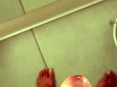 Tempting handjob strokes in the fitting room.