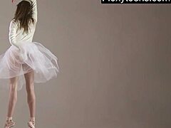 Blonde gymnast stretches flexibly during naked yoga workout in gym